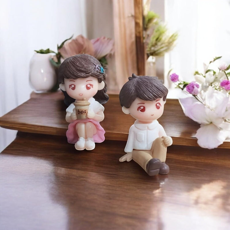 Go Hooked romantic couple figurines, girl in pink dress holding tea cup, boy in white shirt and brown pants, resin material.