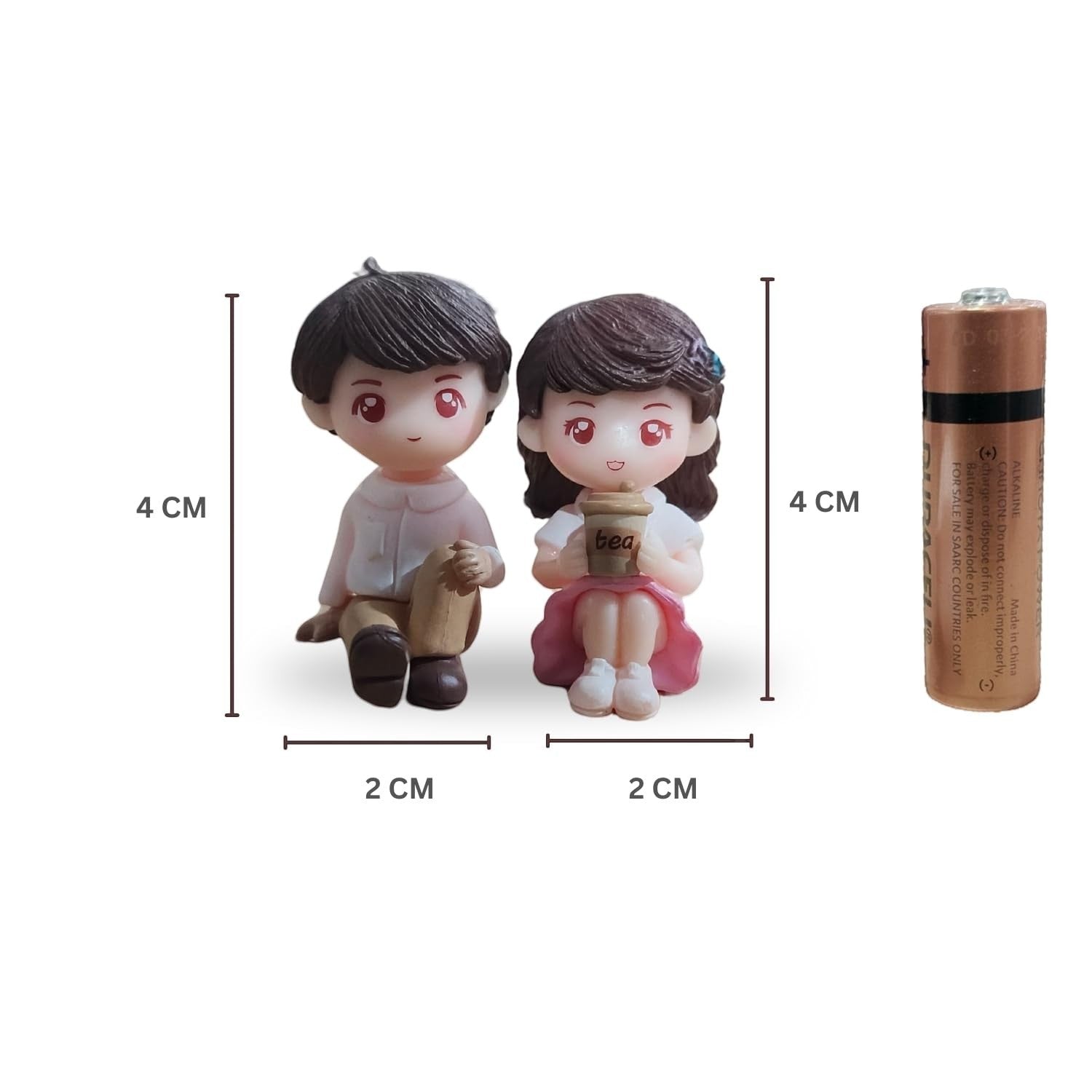 Go Hooked romantic couple figurines, boy in pink shirt and brown pants, girl in pink dress holding tea cup. Resin, 4cm tall.