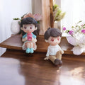 GoHooked romantic couple figurines, girl in blue dress holding pink cup, boy in white shirt and brown pants. Resin material.