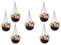 GoHooked dark brown plastic hanging planter with woven rattan look, filled with colorful artificial flowers.