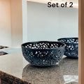 GoHooked set of 2 dark grey plastic fruit bowls with intricate cut-out design. 21cm wide, 9.5cm high.