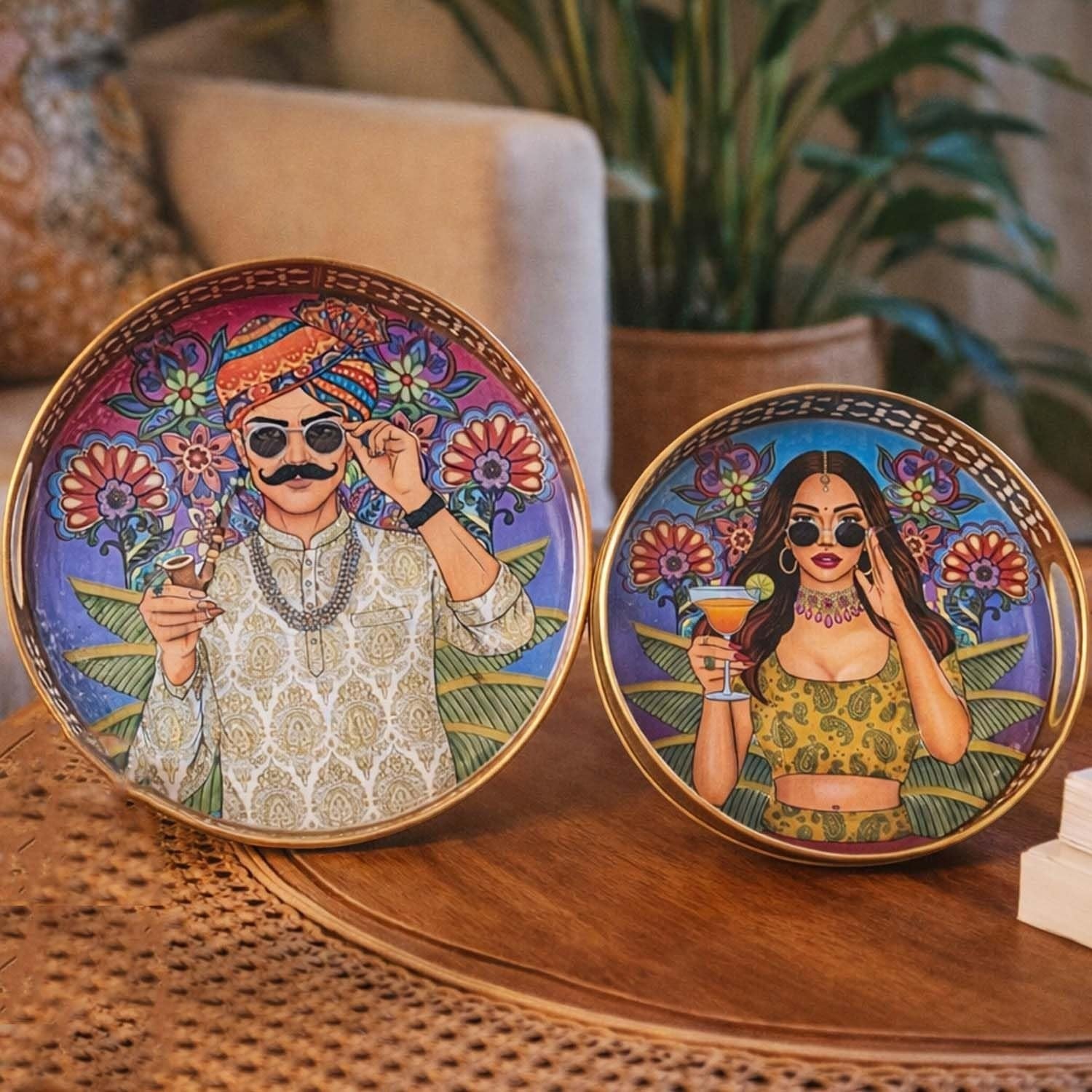 Go Hooked set of 2 round metal decorative trays featuring Indian-inspired couple art with gold rims. 8/10 inch.