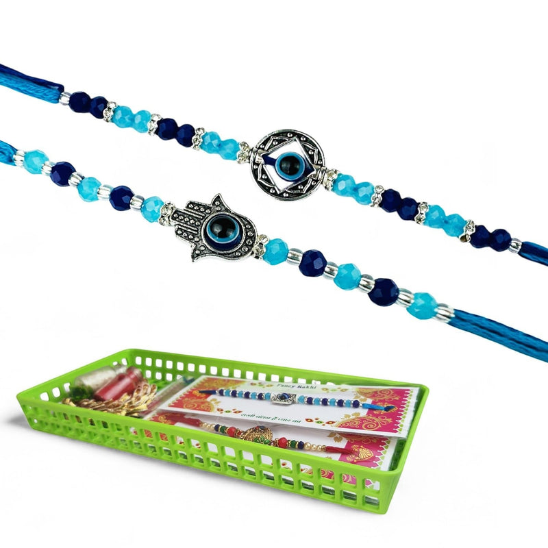 GoHooked multicolor designer rakhis with evil eye and hamsa charms, beaded with blue and clear crystals on blue threads. Includes roli, chawal, and tray.