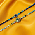 GoHooked designer rakhis with blue beads, black beads, and evil eye charm. One rakhi has a sun/moon motif.