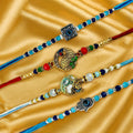 GoHooked set of 4 designer rakhis with pearl beads, peacock, Krishna, and hamsa hand charms. Multicolor.