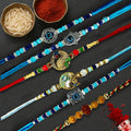 GoHooked set of 6 designer rakhis with pearl beads, evil eye, hamsa hand, and peacock designs. Includes roli, chawal, and tray.