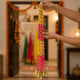 Go Hooked Artificial Door Hanging Latkan with Marigold Pom Poms & Golden Bells Set of 10 | Decorative Toran Garland for Entrance, Temple, Pooja Room, Wedding, Housewarming & Diwali Festival Decoration