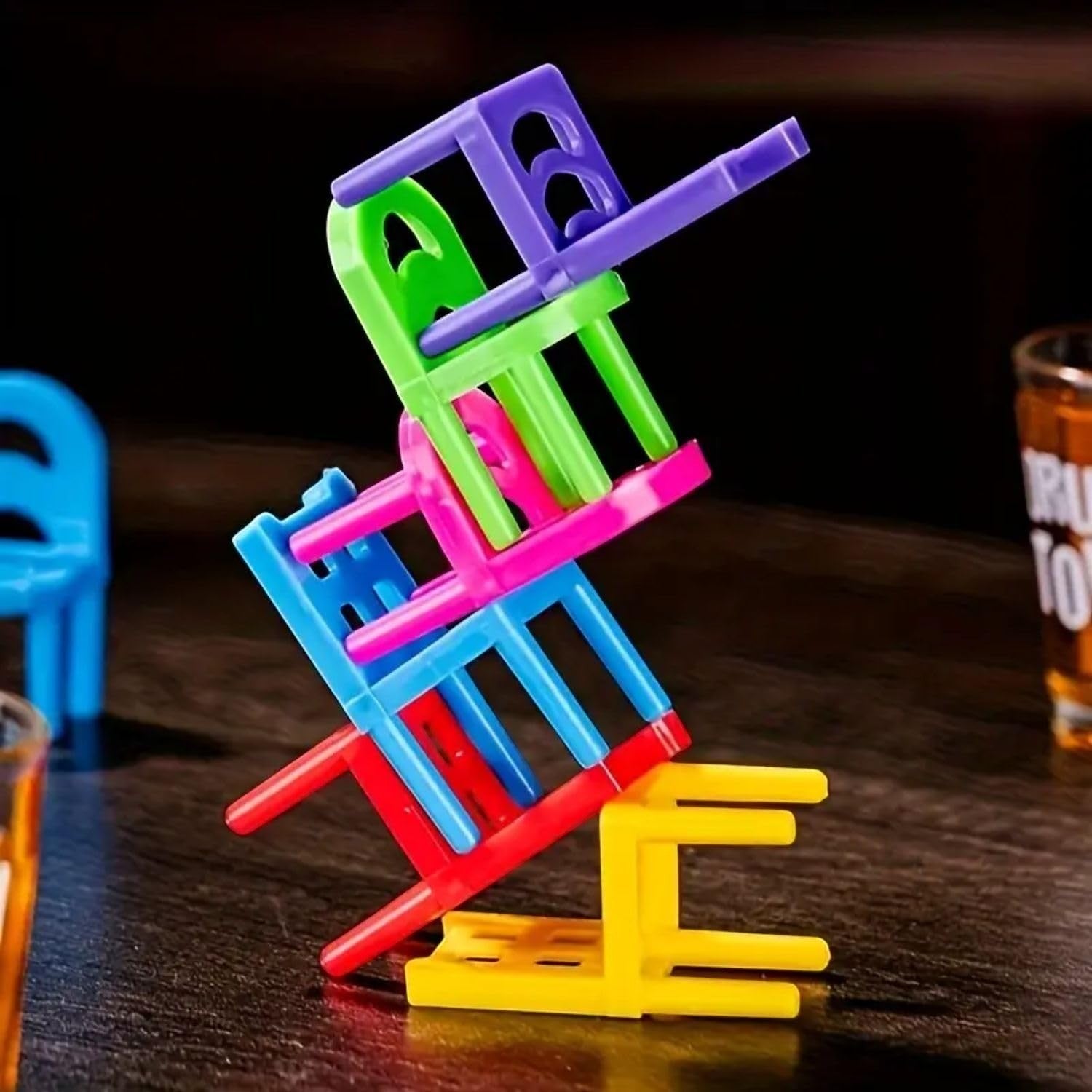 GoHooked Drunken Tower stacking chairs game with colorful plastic stools and shot glasses. A fun party drinking game.