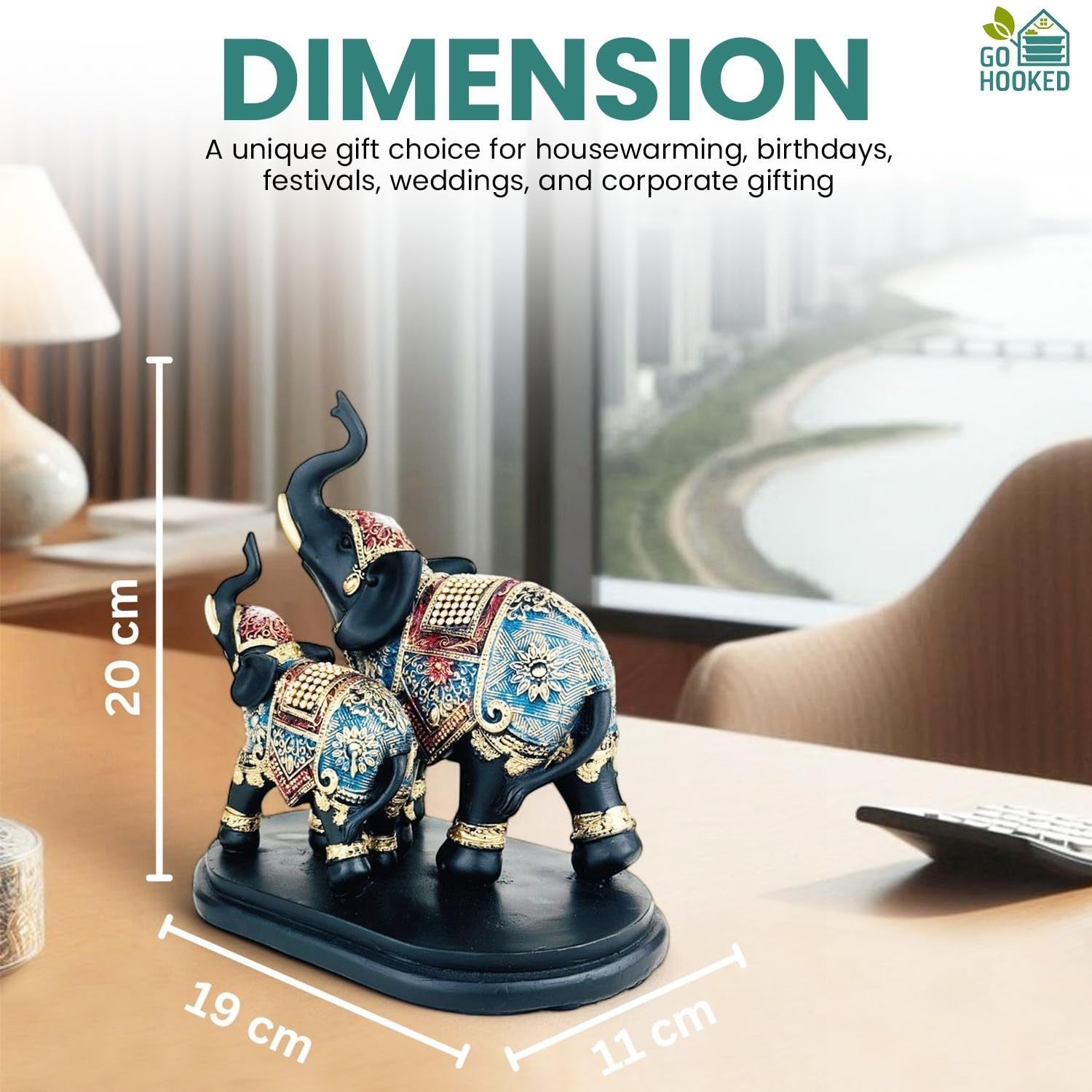 GoHooked black and blue polyresin elephant figurine with gold embellishments, trunk up for good luck. 20cm tall.
