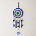 GoHooked blue evil eye dreamcatcher wind chime with silver pipes and blue beads, 64cm height, for positive energy and home decor.