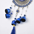 GoHooked blue glass evil eye wind chime with 5 bells and tassel. Metal alloy medallion with blue glass accent.
