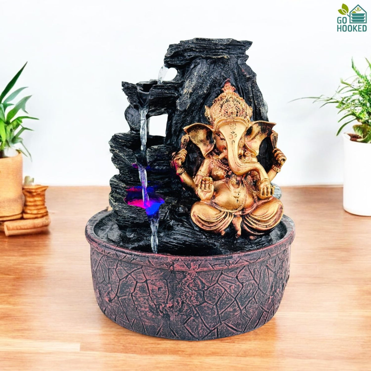 GoHooked Lord Ganesha polyresin tabletop fountain with LED lights and adjustable water flow, black rock design.