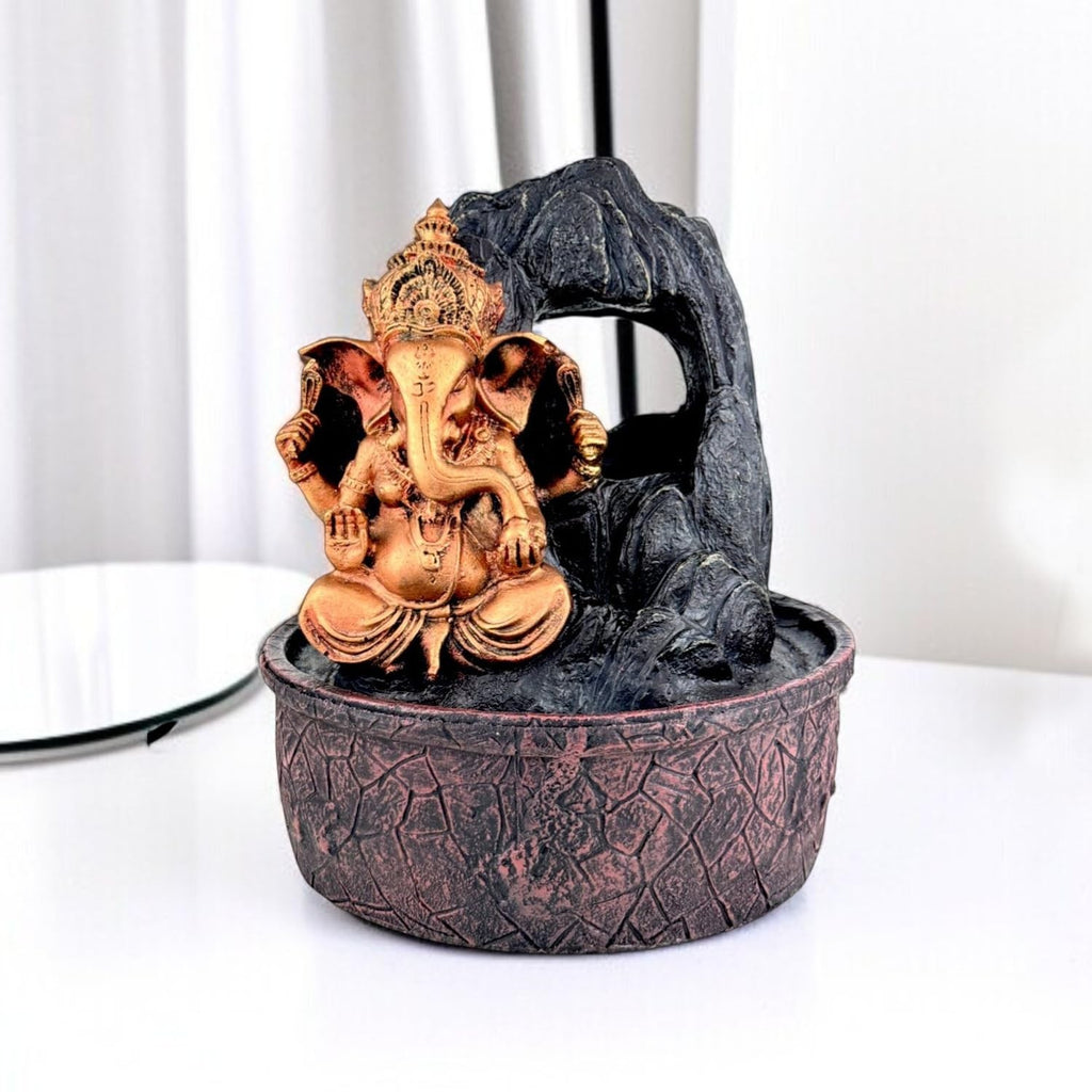 GoHooked Ganesha tabletop water fountain, bronze polyresin, with LED crystal ball and rock waterfall. Indoor decor.