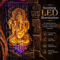 GoHooked multicolour polyresin Lord Ganesha tabletop water fountain with LED light and pump. Features a golden Ganesha idol with flowing water and purple LED illumination.