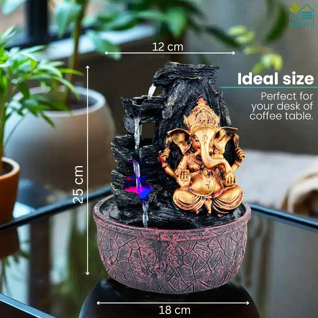 GoHooked Lord Ganesha polyresin tabletop fountain with LED lights and adjustable water flow. Ideal for meditation and decor.