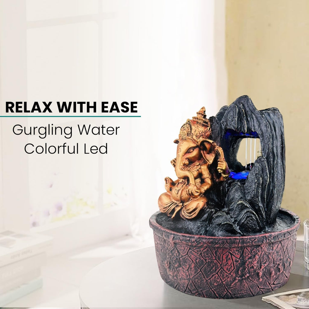 GoHooked Lord Ganesha polyresin tabletop fountain with LED lights and adjustable water flow, bronze and black.
