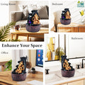 GoHooked Lord Ganesha polyresin tabletop fountain with LED lights and adjustable water flow. Bronze finish.