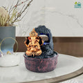 Go Hooked Lord Ganesha polyresin tabletop fountain with LED lights and adjustable water flow, bronze and black.