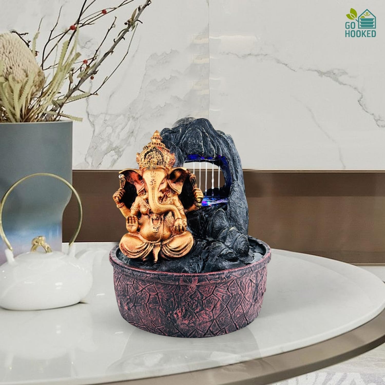 Go Hooked Lord Ganesha polyresin tabletop fountain with LED lights and adjustable water flow, bronze and black.