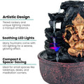 GoHooked Lord Ganesha polyresin tabletop fountain with tiered rockery, LED lights, and adjustable water flow.