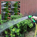 GoHooked clear 7.5m PVC braided garden hose pipe with 7-pattern sprayer gun watering plants.
