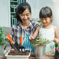 GoHooked 5-piece gardening tool set with orange soft-grip handles, including fork, transplanter, weeder, pruner, and gloves.