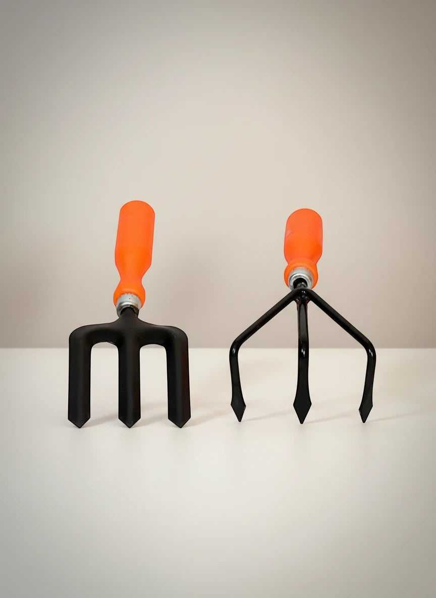 Go Hooked gardening tools: black metal cultivator and fork with orange plastic handles, powder coated for rust resistance.