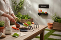 GoHooked 3-piece gardening tool set with orange handles: trowel, cultivator, and weeder. Metal with powder coating.