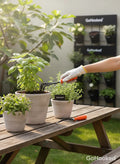 GoHooked gardening tools kit with orange handles, including a cultivator and weeder, for potted plants.