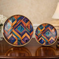 Go Hooked set of 2 round metal decorative trays with gold rims and colorful geometric art. 8/10 inch.