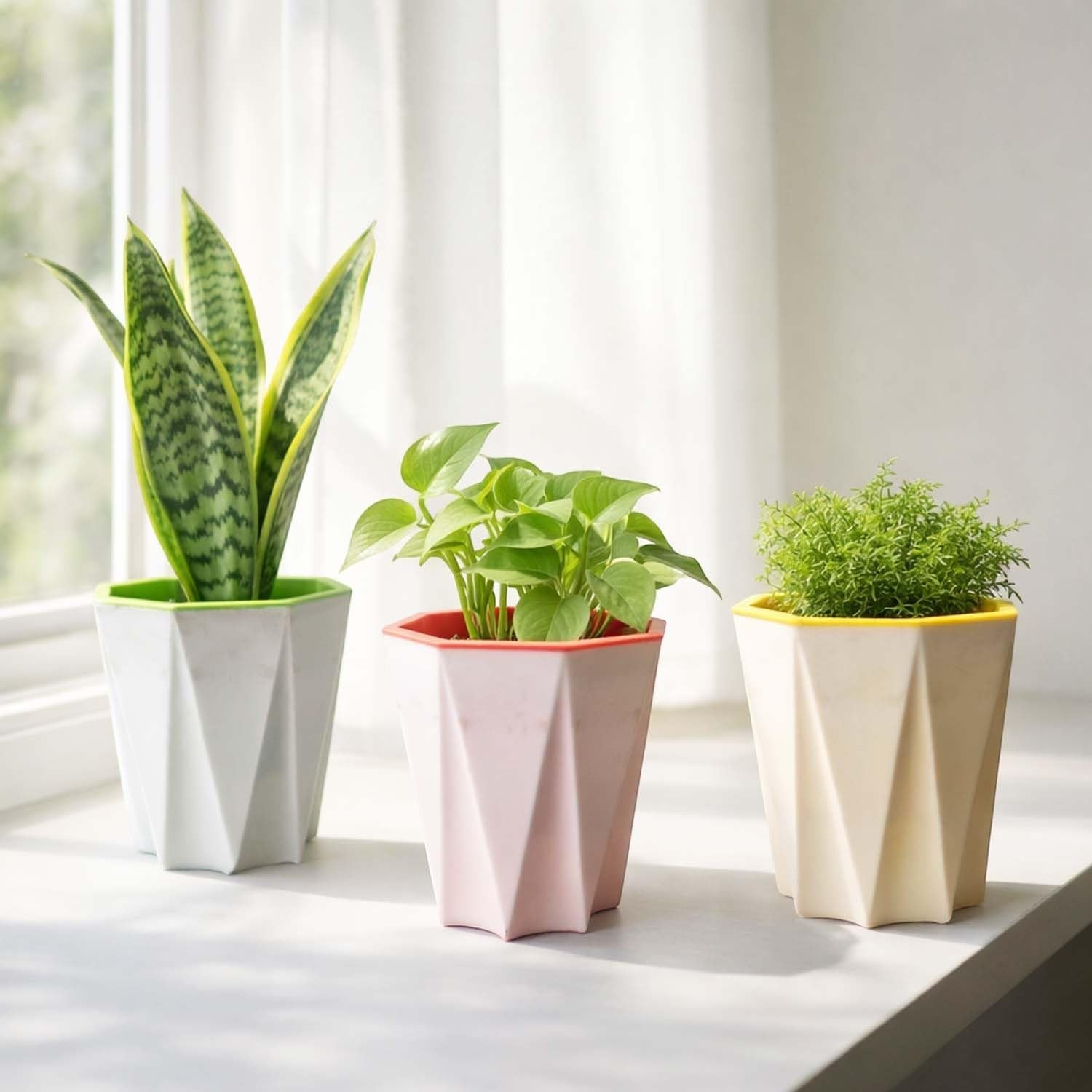 GoHooked white, pink, and cream plastic plant pots with geometric design and colored rims. Set of 3.