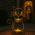 GoHooked gold metal cat tealight candle holder with two trays and lit candles, 21cm tall decorative stand.