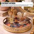 Go Hooked gold metal decorative tray with geometric art inlay, featuring cut-out rim and handles. Ideal for styling coffee tables.