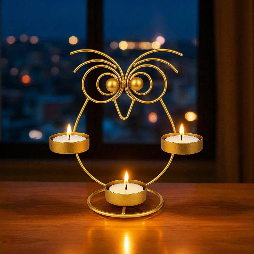 GoHooked gold iron owl tealight candle holder with 3 trays and lit candles.