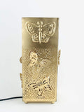 Go Hooked gold metal table lamp with butterfly cutouts and embossed butterfly design. Square shape, 9.8 inches.