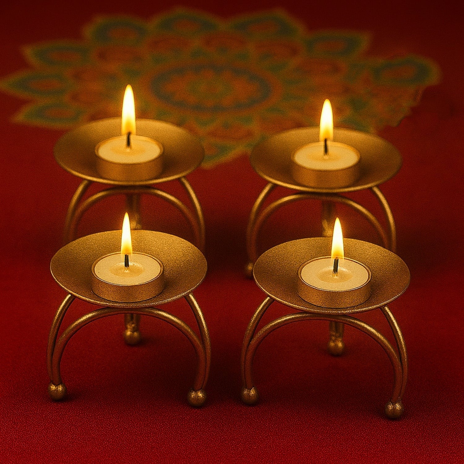 GoHooked gold metal pedestal tealight candle holders with a tripod base, set of 4, ideal for Diwali decor.