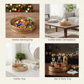 Go Hooked set of 2 round gold metal decorative trays with geometric cutouts. Ideal for serving or display.