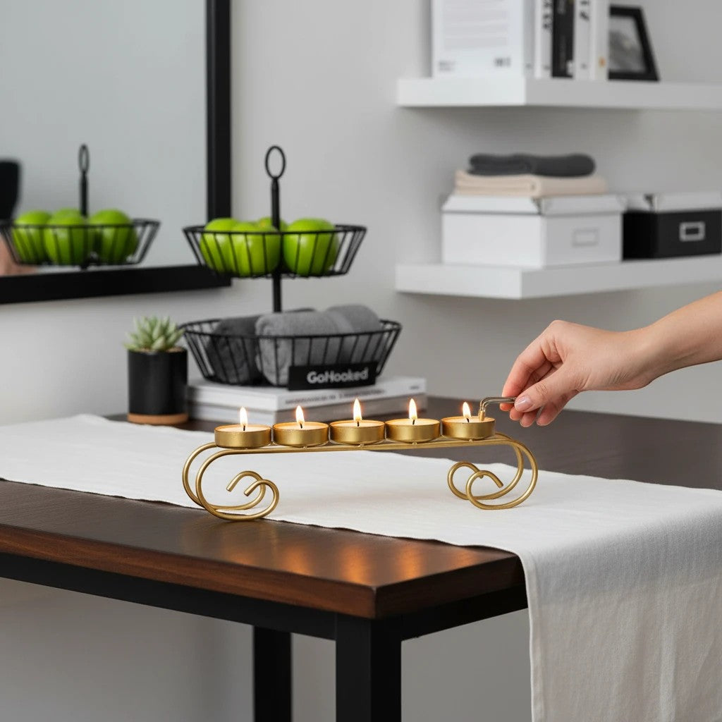 GoHooked gold metal 5-tealight holder with scroll base, 28cm long, decorative iron candle stand.