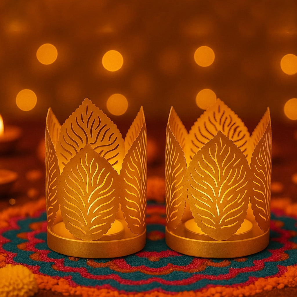 GoHooked set of 2 gold metal crown-shaped tealight holders with leaf cutouts, ideal for festive decor.