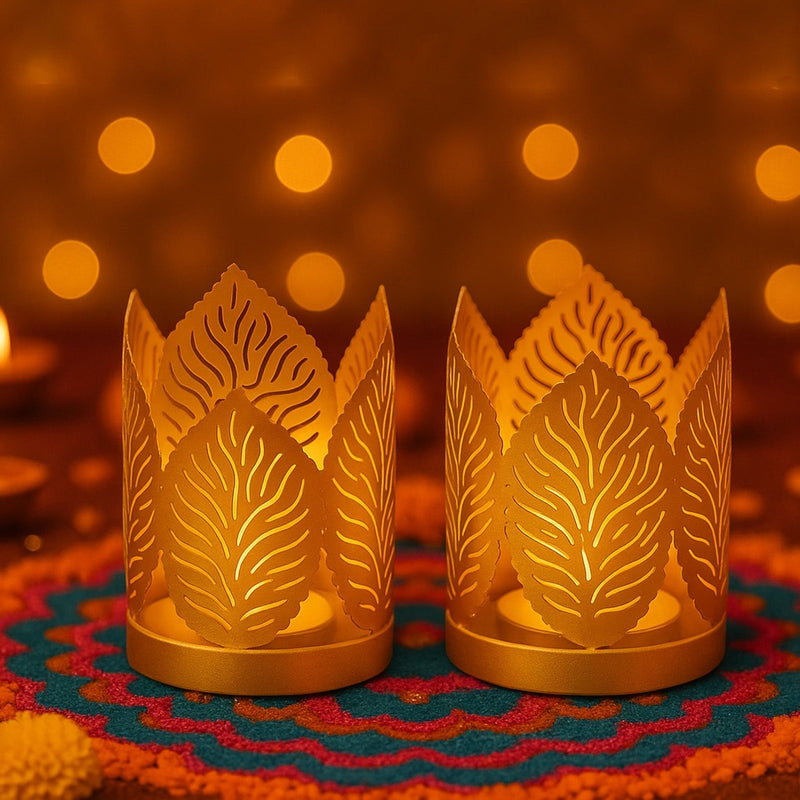 GoHooked set of 2 gold metal crown-shaped tealight holders with leaf cutouts, ideal for festive decor.