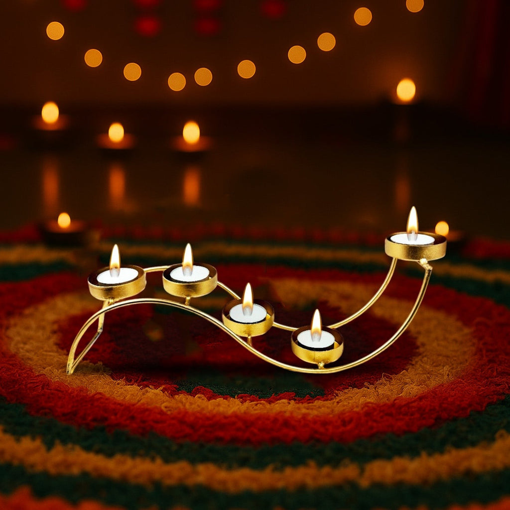 GoHooked gold metal wave tealight candle holder with 5 trays on a colorful rug, 38cm