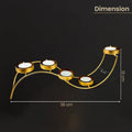 GoHooked matte gold metal wave tealight holder with 5 candle slots, 38cm long, ideal for Diwali and table centerpieces.
