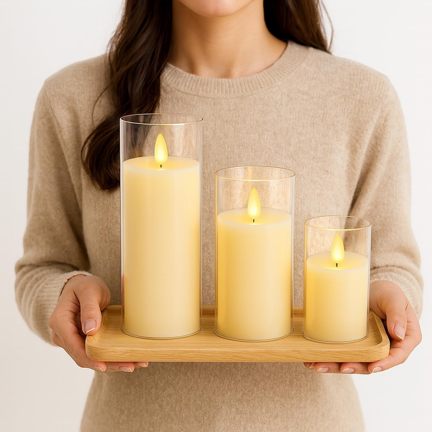 GoHooked set of 3 golden acrylic LED tea light candles with flickering flame effect in glass holders on a wooden tray.
