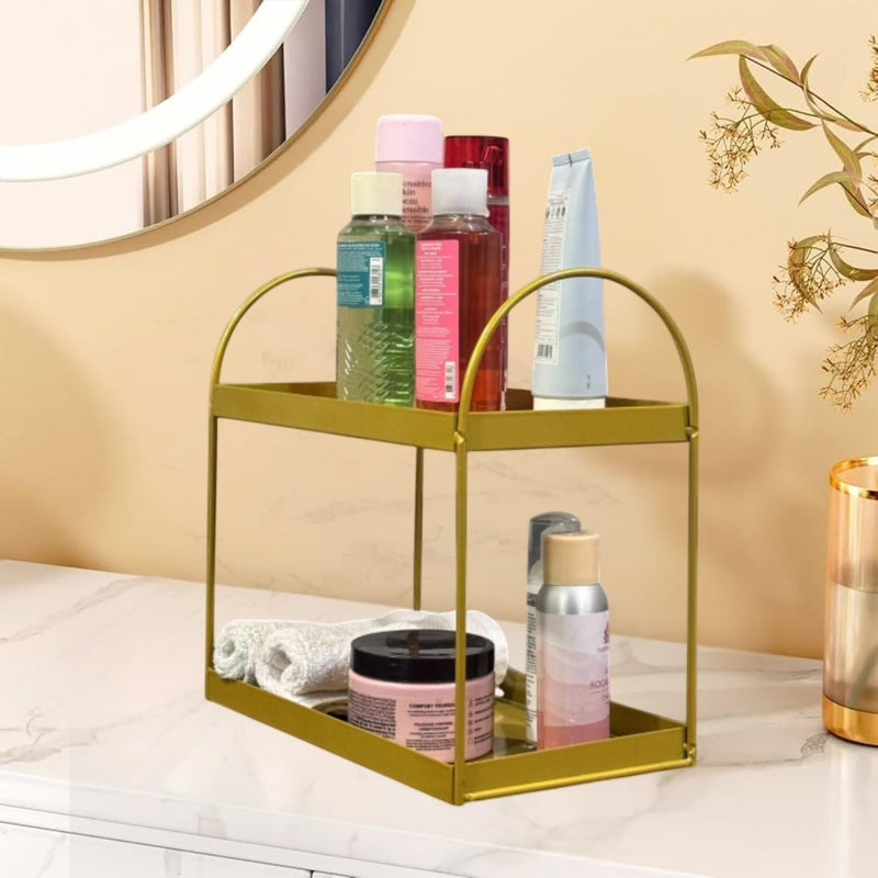 GoHooked golden metal 2-tier standing rack organizer with skincare products and towels on a marble countertop.