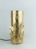 GoHooked golden metal bedside table lamp with butterfly cutouts and perforated design. Touch switch.
