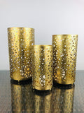 Set of 3 Go Hooked golden metal table lamps with intricate cut-out patterns, perfect for bedside or living room decor.