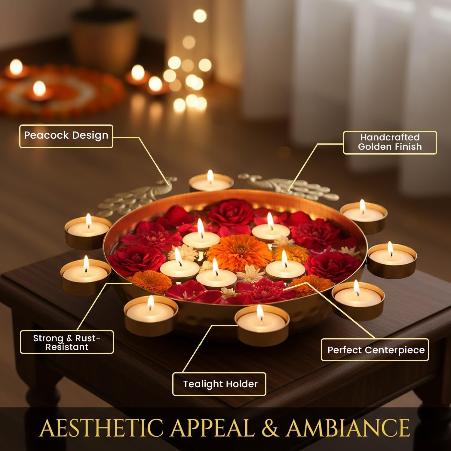 GoHooked Golden Peacock Urli bowl with 8 tealight holders, filled with red and orange flowers and petals. Metal centerpiece.