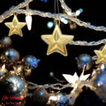 GoHooked golden star Christmas ornaments with glitter accents, part of a festive decor set.