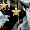 GoHooked golden star Christmas ornaments, 3-inch, pack of 6. Glittery and reusable, perfect for trees, walls, and doors.