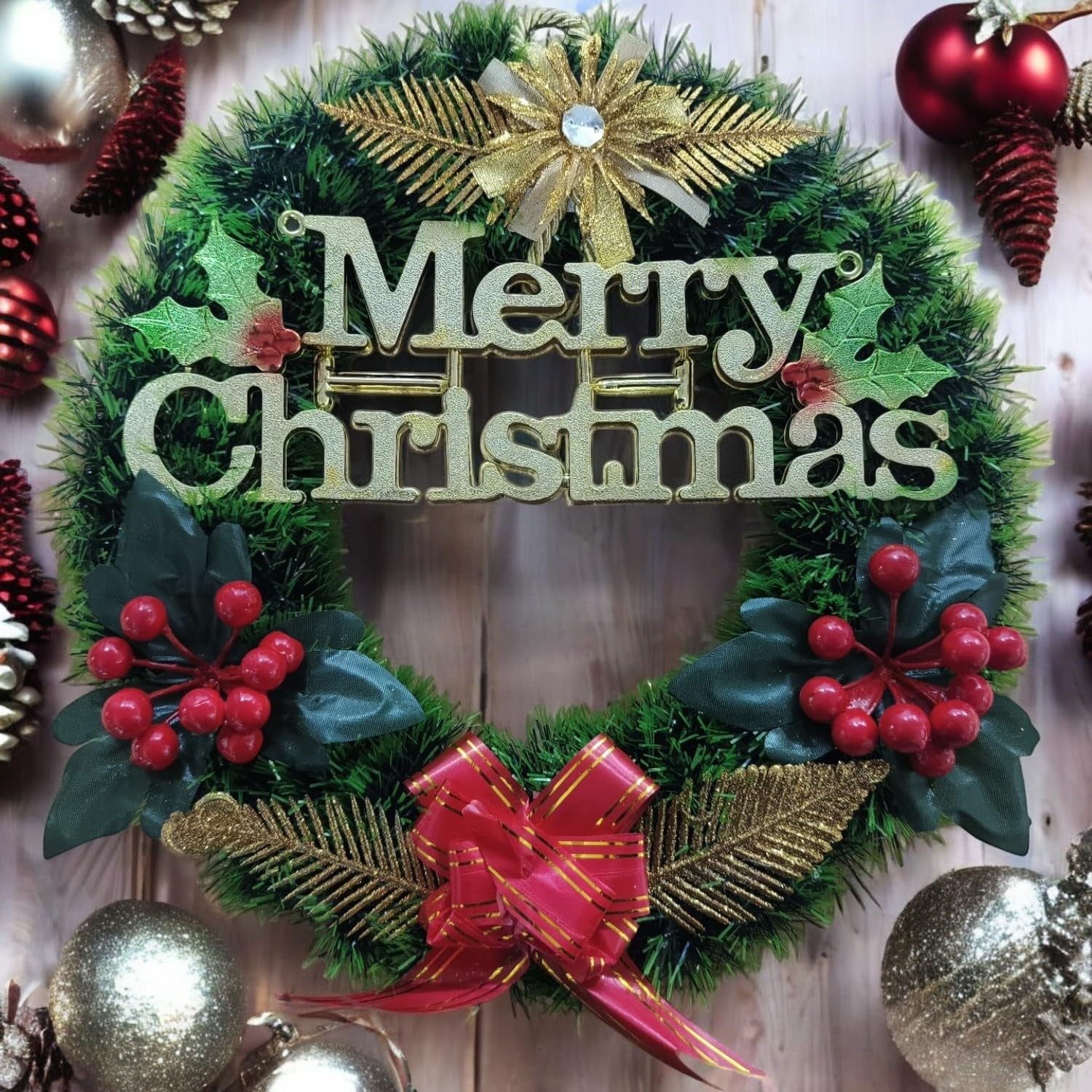 GoHooked green Christmas wreath with "Merry Christmas" text, red berries, gold accents, and a red bow.